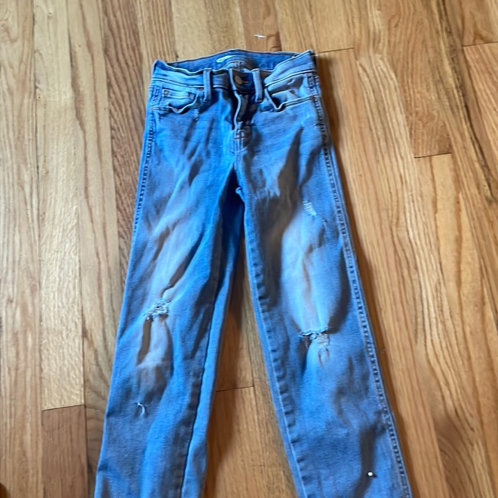 they are blue jeans, (straight) and have two little rips on the legs.